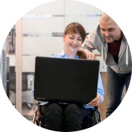 Handicapped young woman in office with a coworker